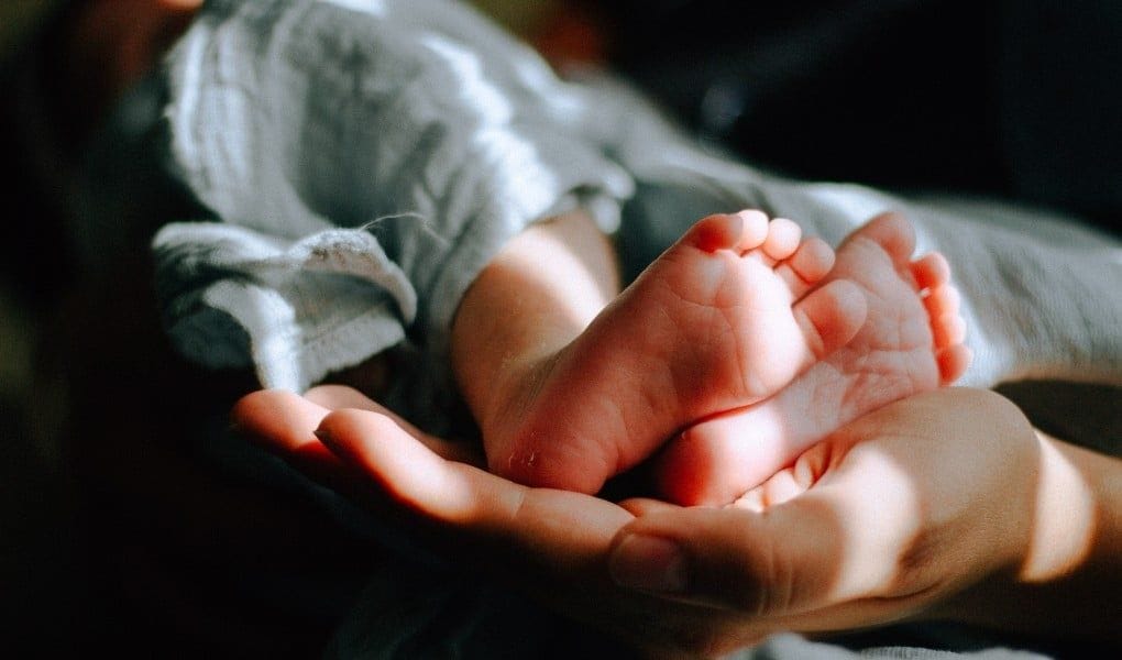 someone holding baby