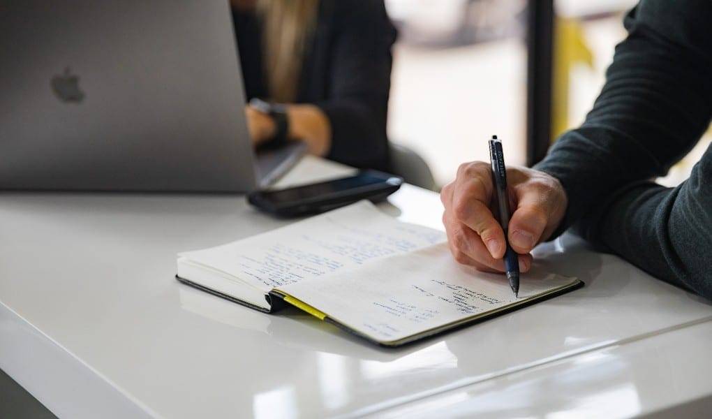 person writing notes