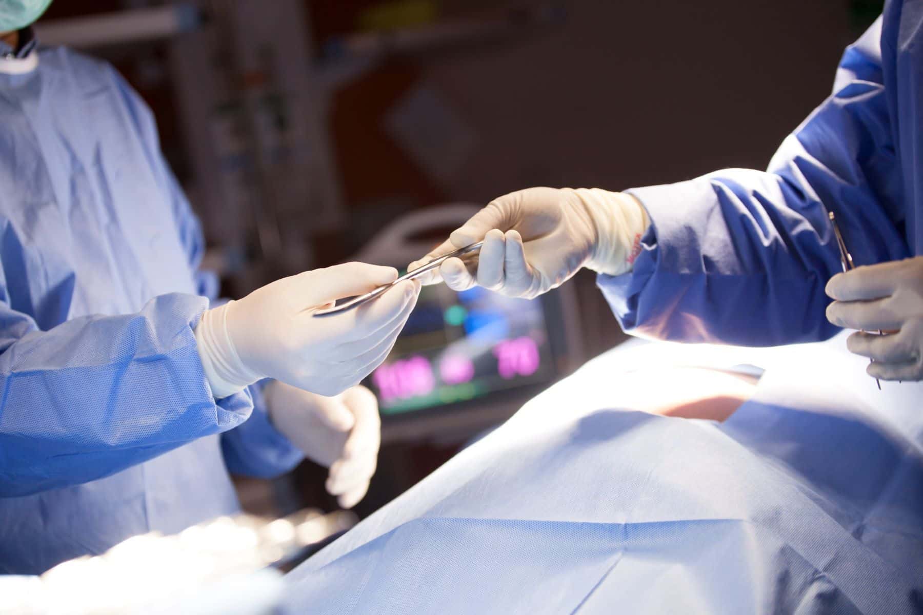 Team of surgeons operating in hospital