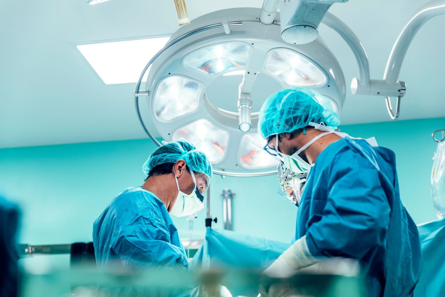 Group of surgeons operating