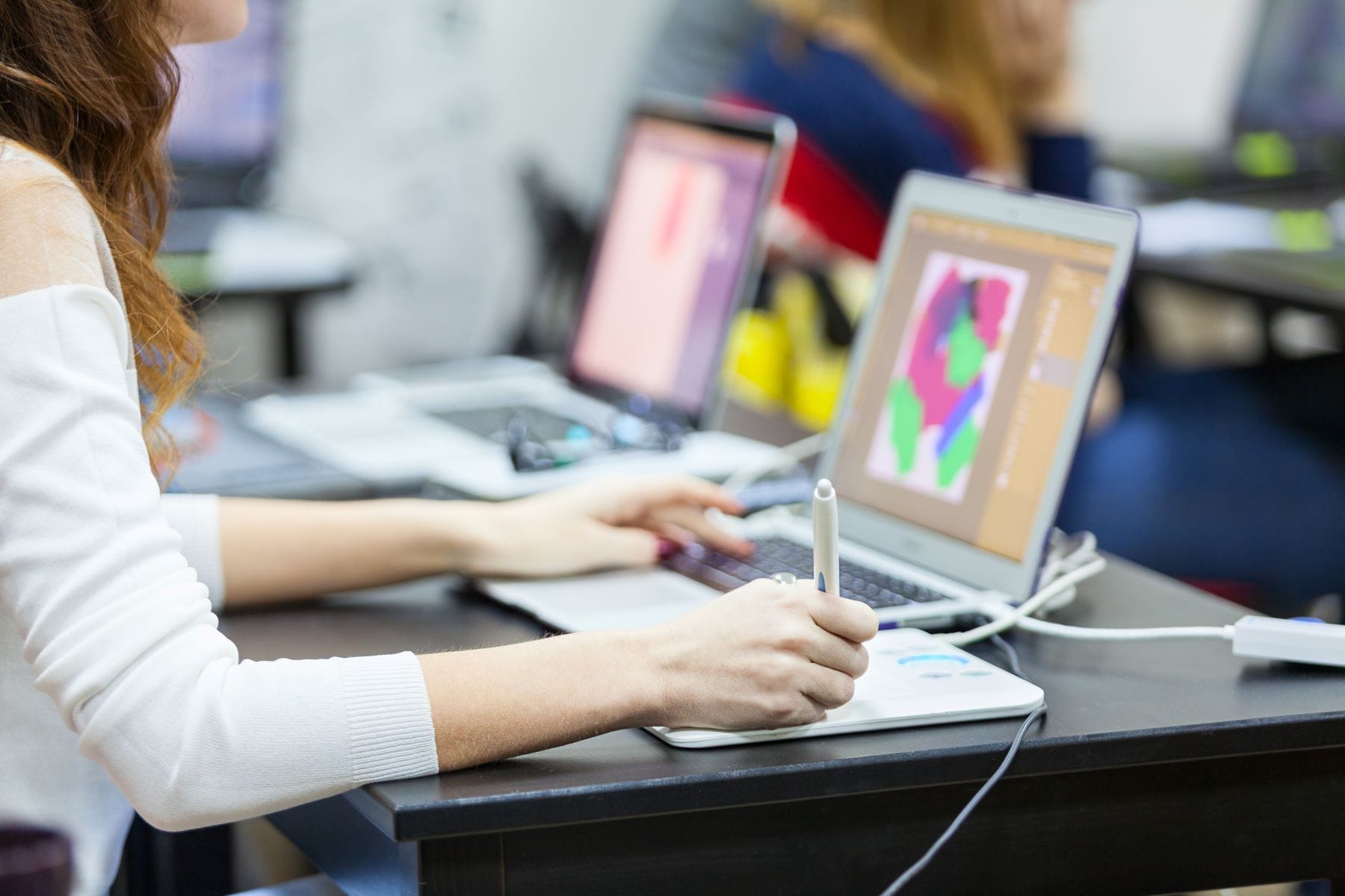 Artist working on laptop computer