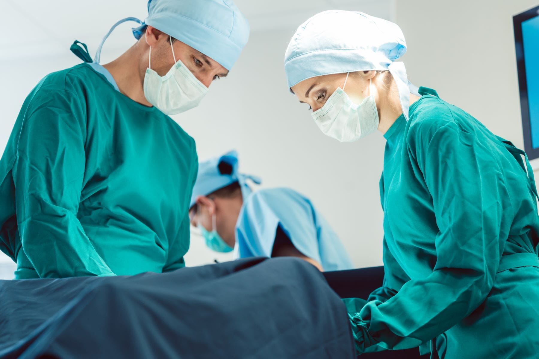 Surgeons performing c-section