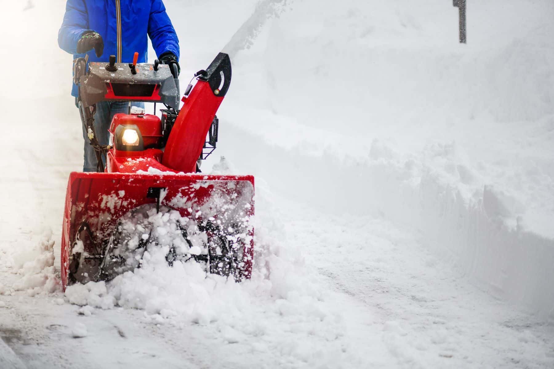 Person using snowblower