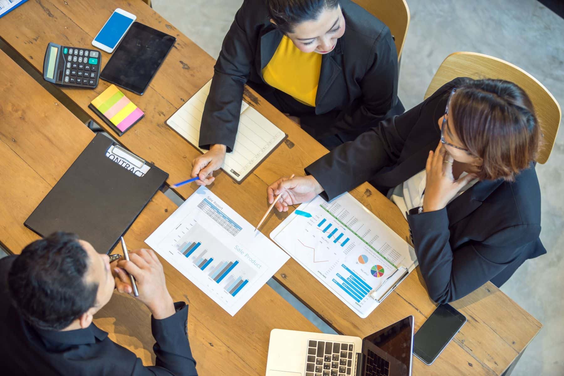 Group of employees reviewing financial documents