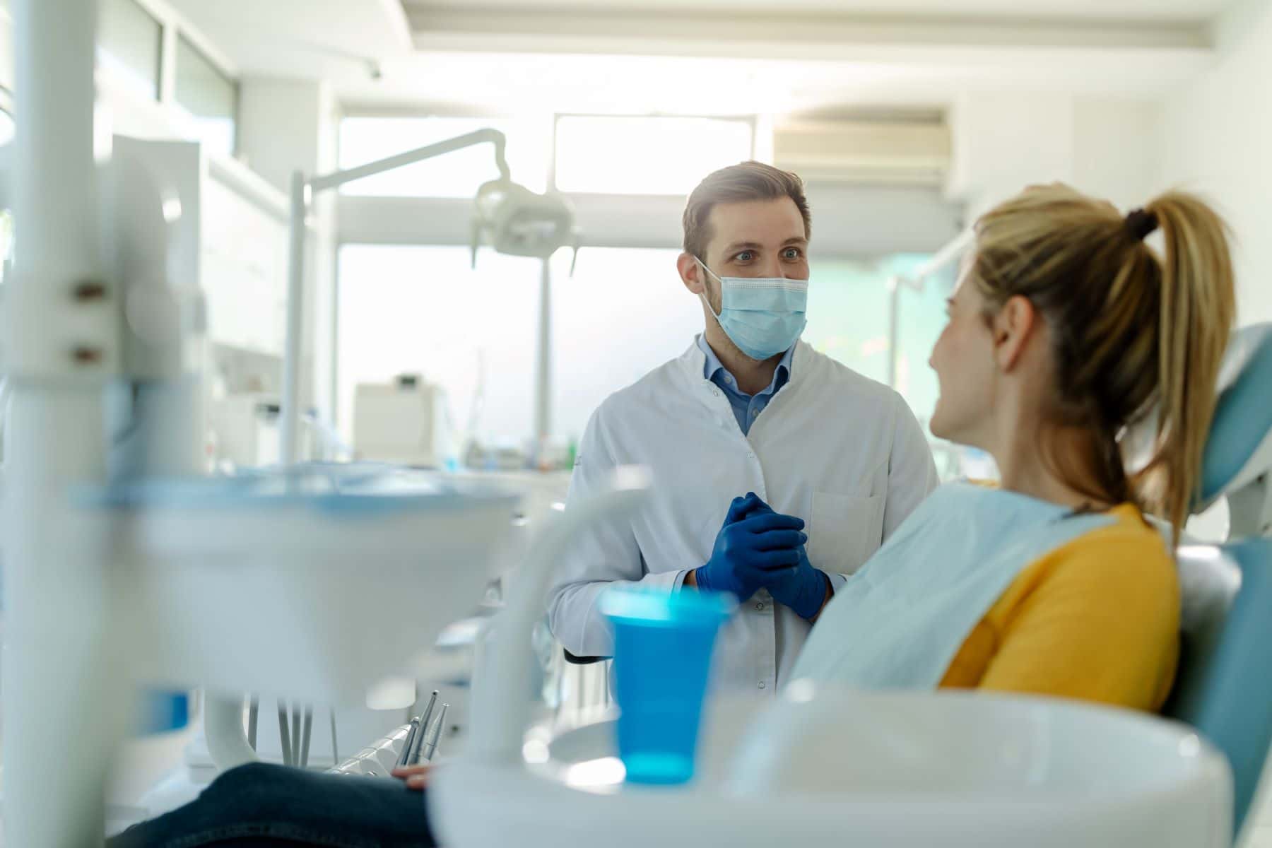 Dentist talking to patient