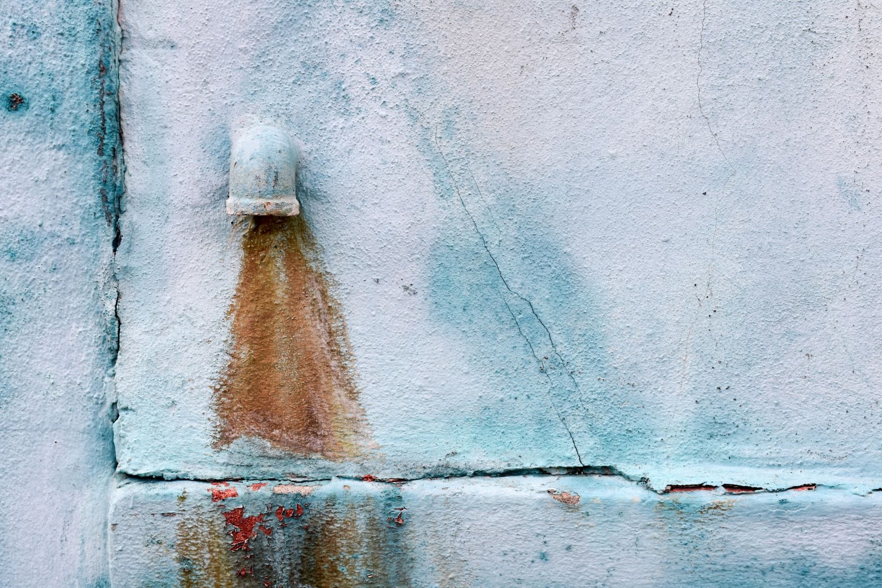 Rusty water pouring from tap