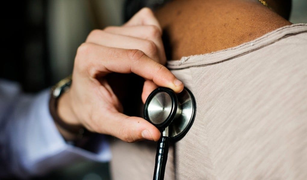 Physician using stethoscope