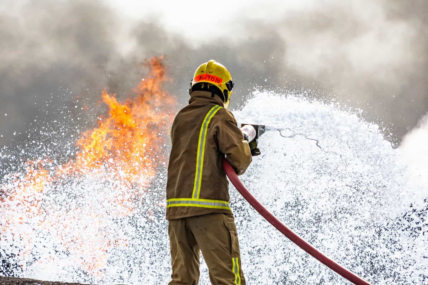 Firefighter using foam