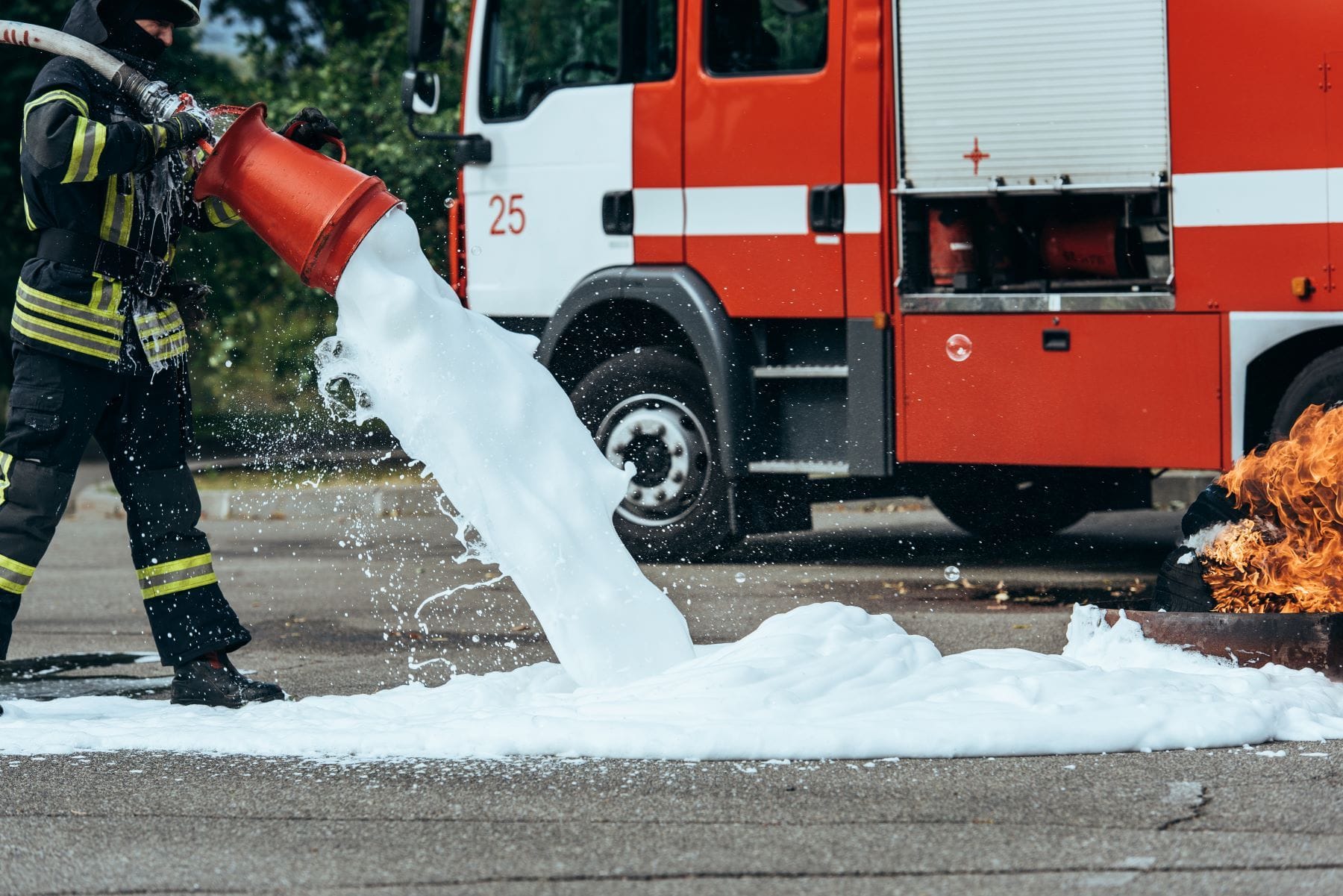 Firefighter using foam