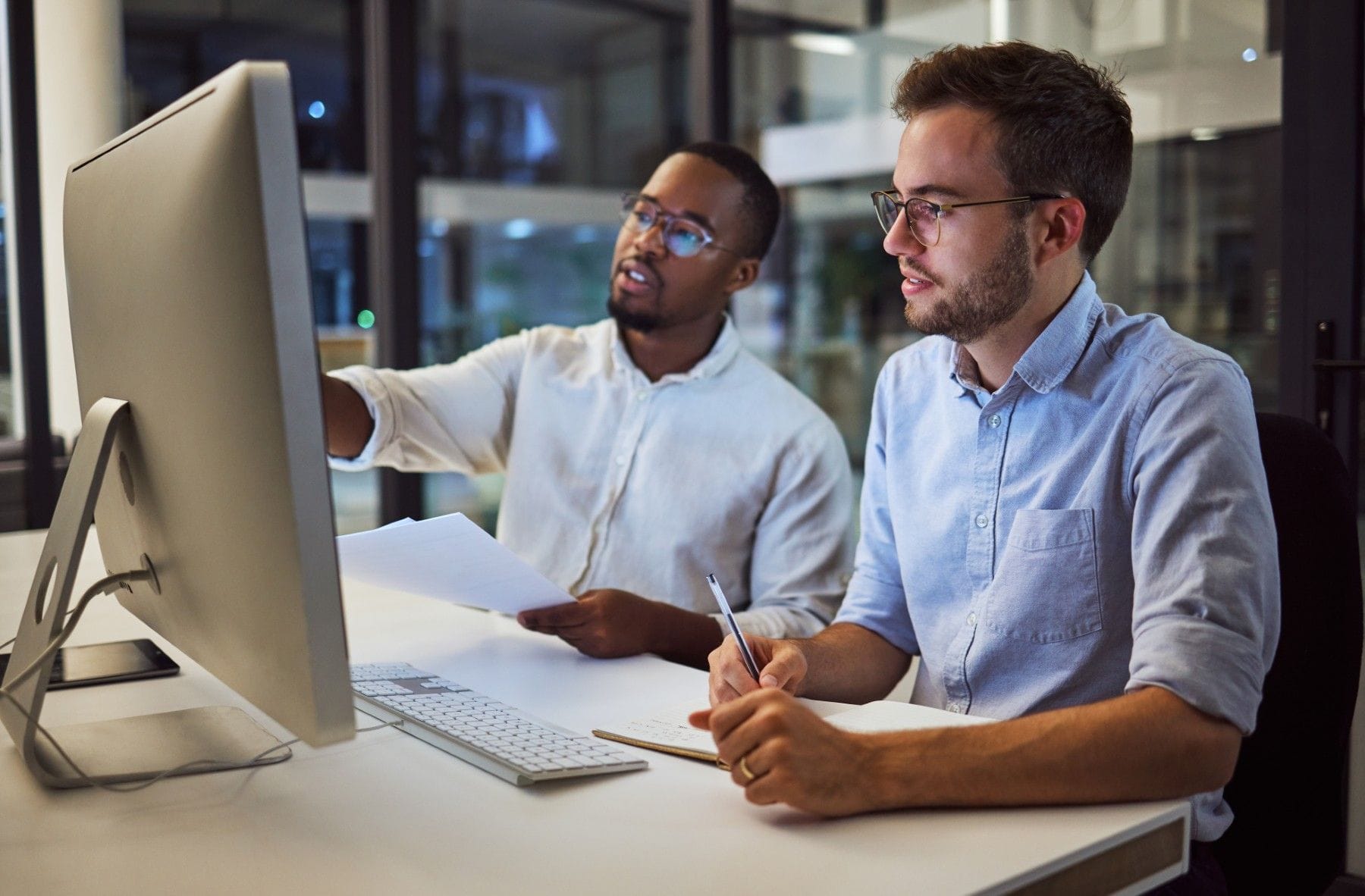 Two professionals researching