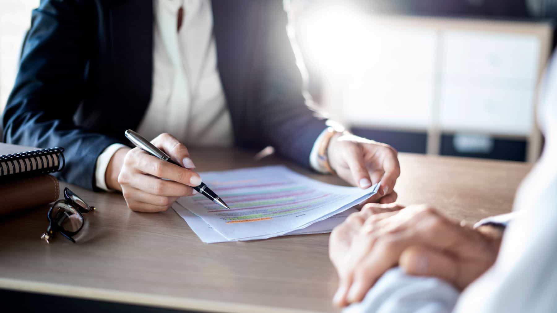 Attorneys reviewing documents in meeting