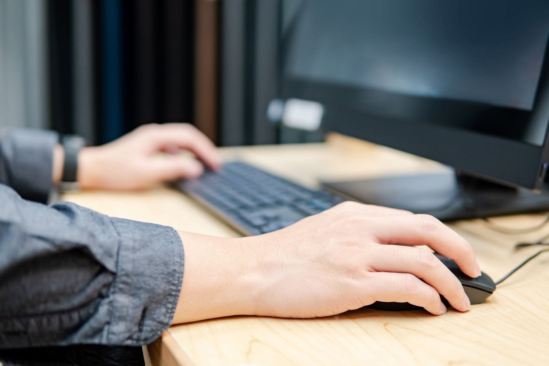 Expert working on desktop computer