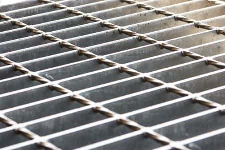 Slip and Fall on Slippery Sidewalk Grate Violated Codes, Expert Says